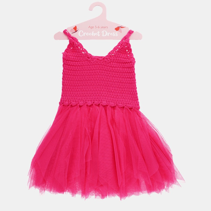 Children's Crochet Dress in Bright Pink on hanger