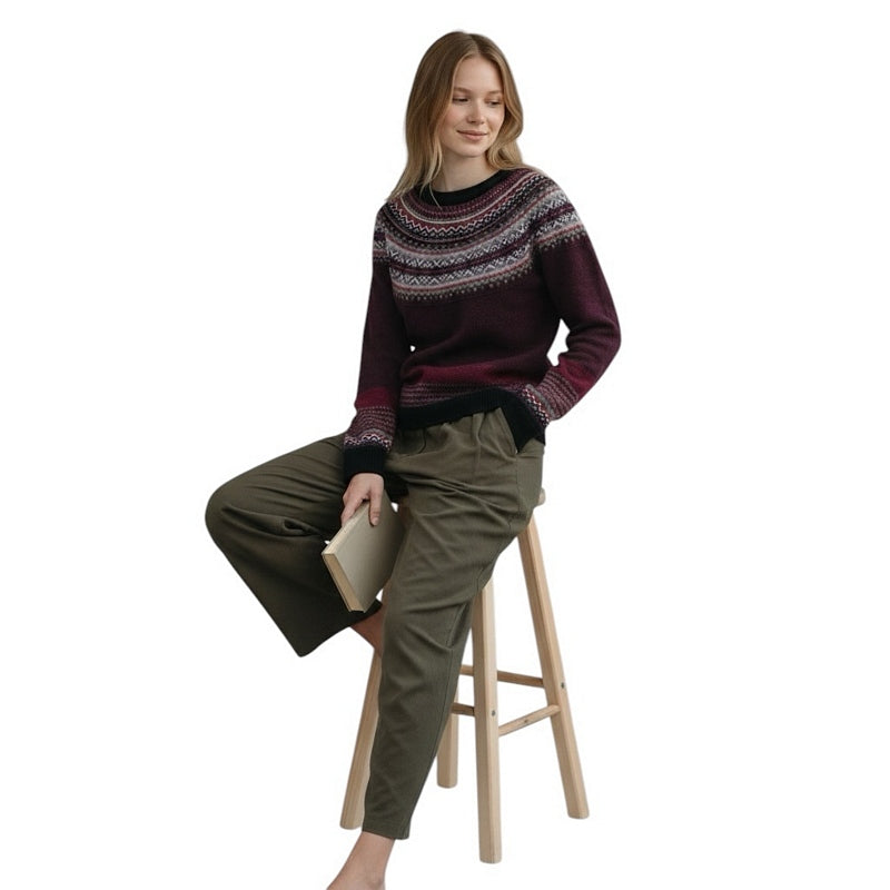 Eribe Knitwear Alpine Sweater Tyrian on model sitting