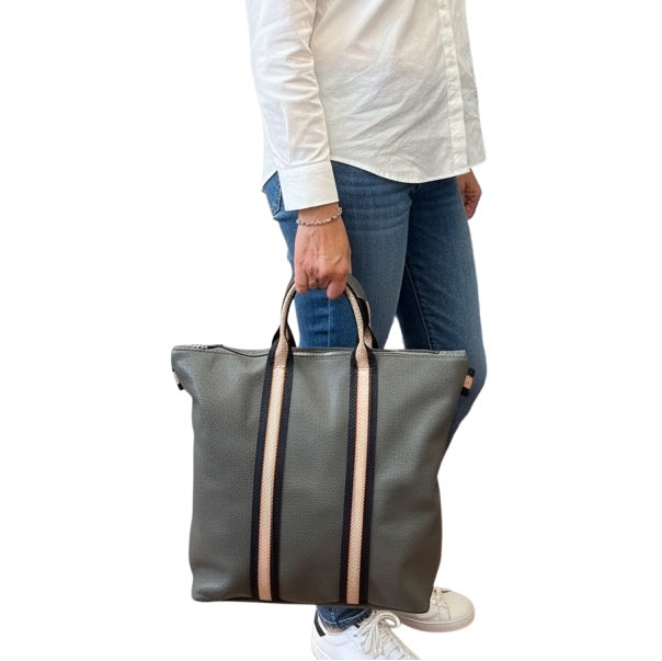 Italian Leather Multi Shoulder and Backpack in Dark Grey held in model's hand