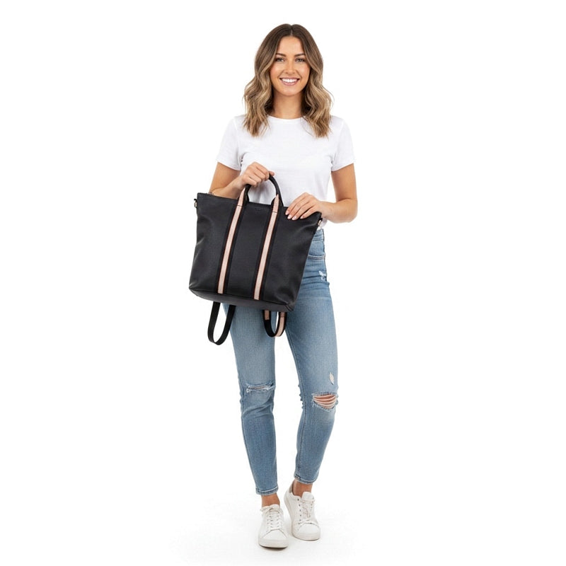 Italian Leather Multi Shoulder and Backpack in Navy held by model front