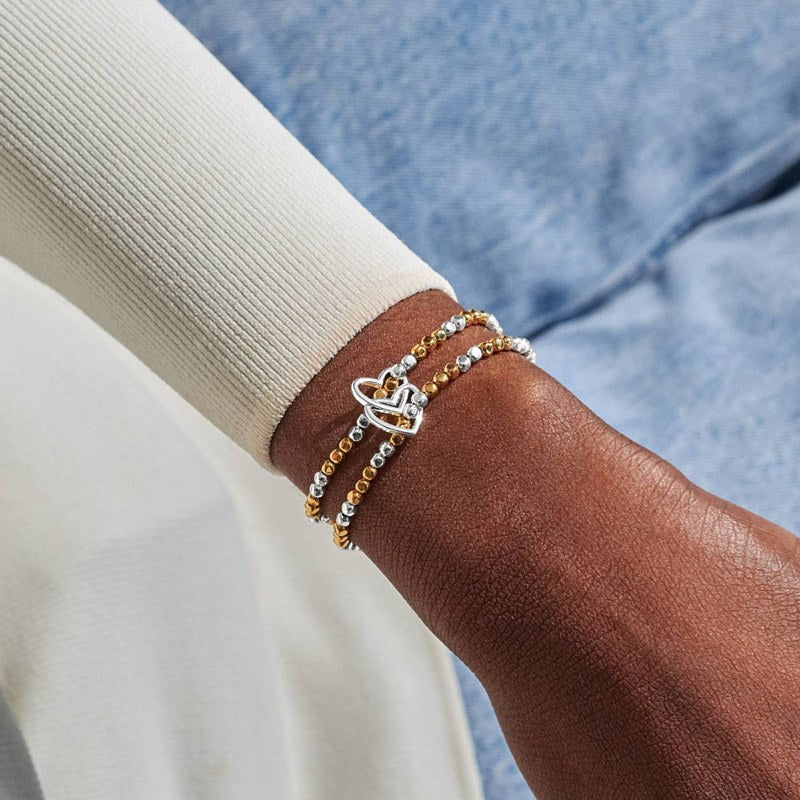 Joma Jewellery Reva Double Heart Linked Bracelets Silver and Gold 10043 on model