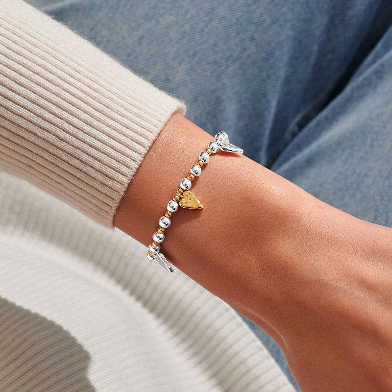 Joma Jewellery Reva Textured Hearts Bracelet Silver and Gold 10035 on model solo