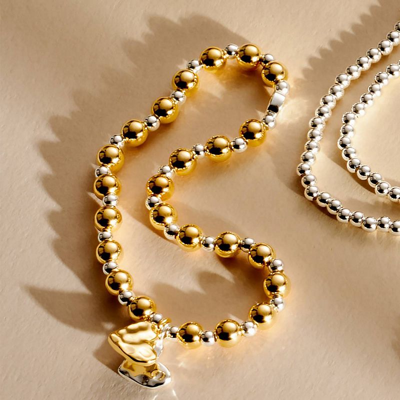 Joma Jewellery Reva Textured Offset Hearts Bracelet Silver and Gold 10037 lifestyle