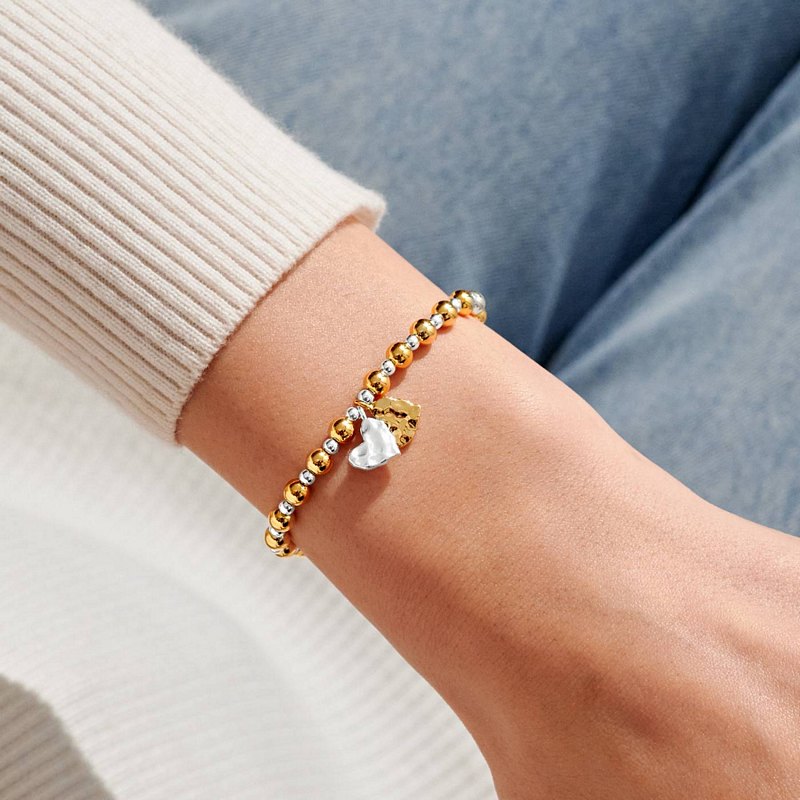 Joma Jewellery Reva Textured Offset Hearts Bracelet Silver and Gold 10037 on model