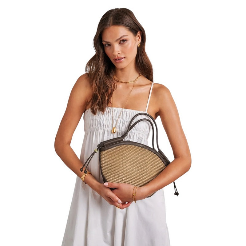 Katie Loxton Florence Mini Tote Bag Natural Raffia Bitter Chocolate KLB4451 held by model