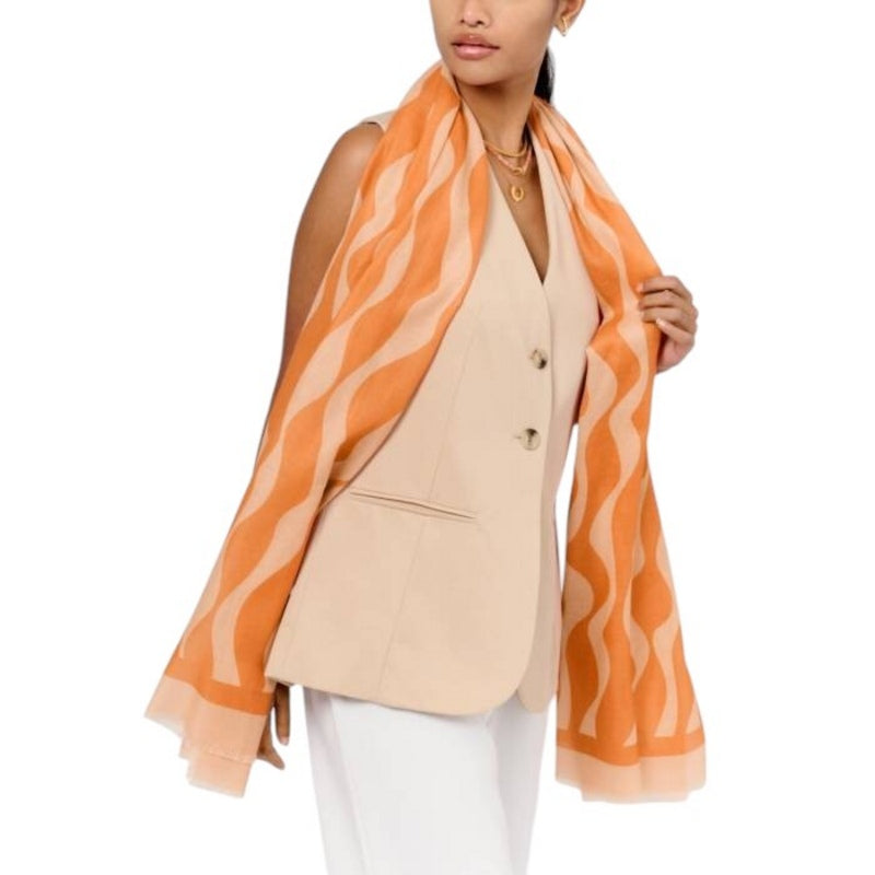 Katie Loxton Printed Ripple Wave Scarf in Orange and Pink KLS667 model