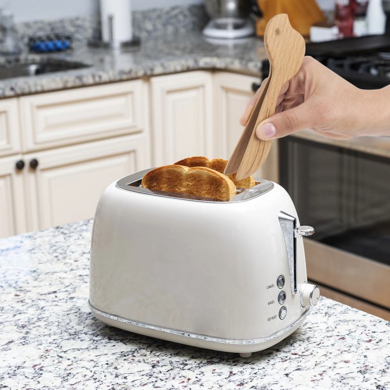 Kikkerland Bird Wooden Toaster Tongs CU348 in use
