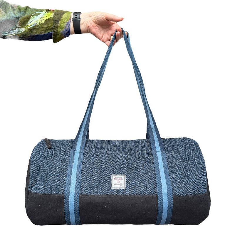 Maccessori Blue Harris Tweed Barrel Holdall held by model