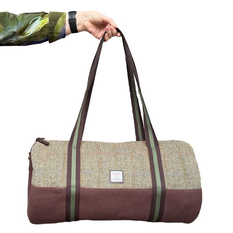 Maccessori Country Green Harris Tweed Barrel Holdall held by model