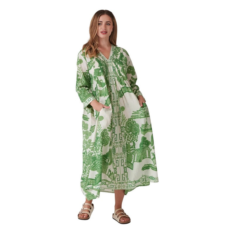 One Hundred Stars Giant Willow Green Pinch Pleat Dress on model with hands in pockets