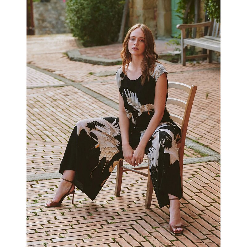 One Hundred Stars Stork Black Jumpsuit on model sitting lifestyle