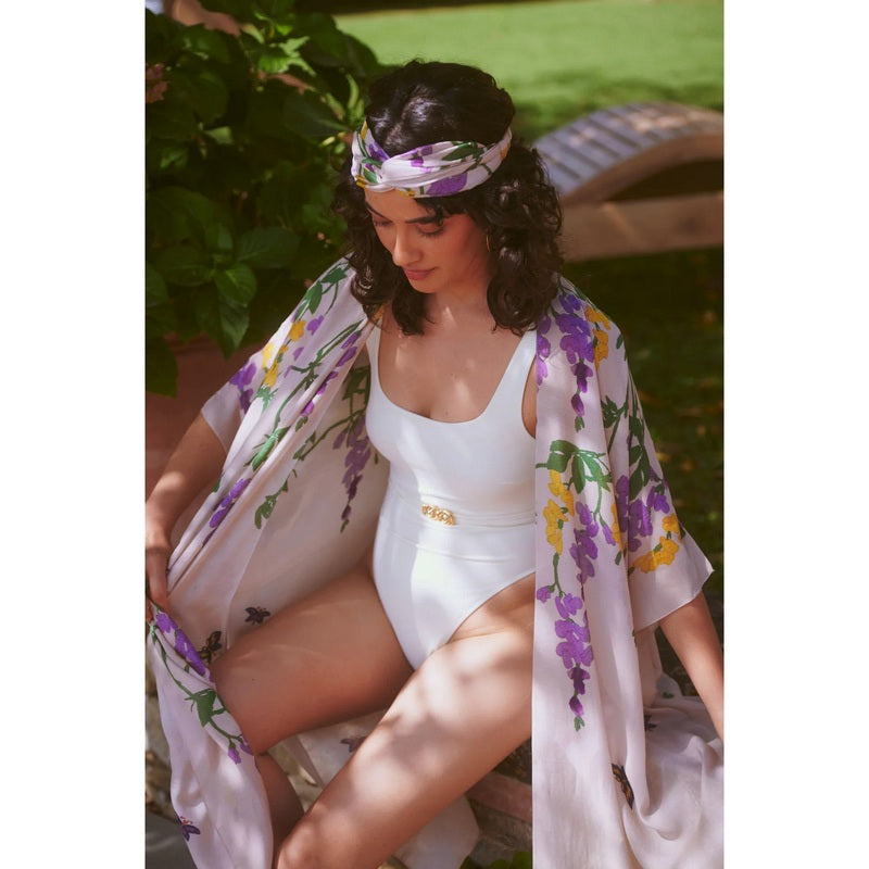 One Hundred Stars Throwover Wisteria Lilac on model sitting 2