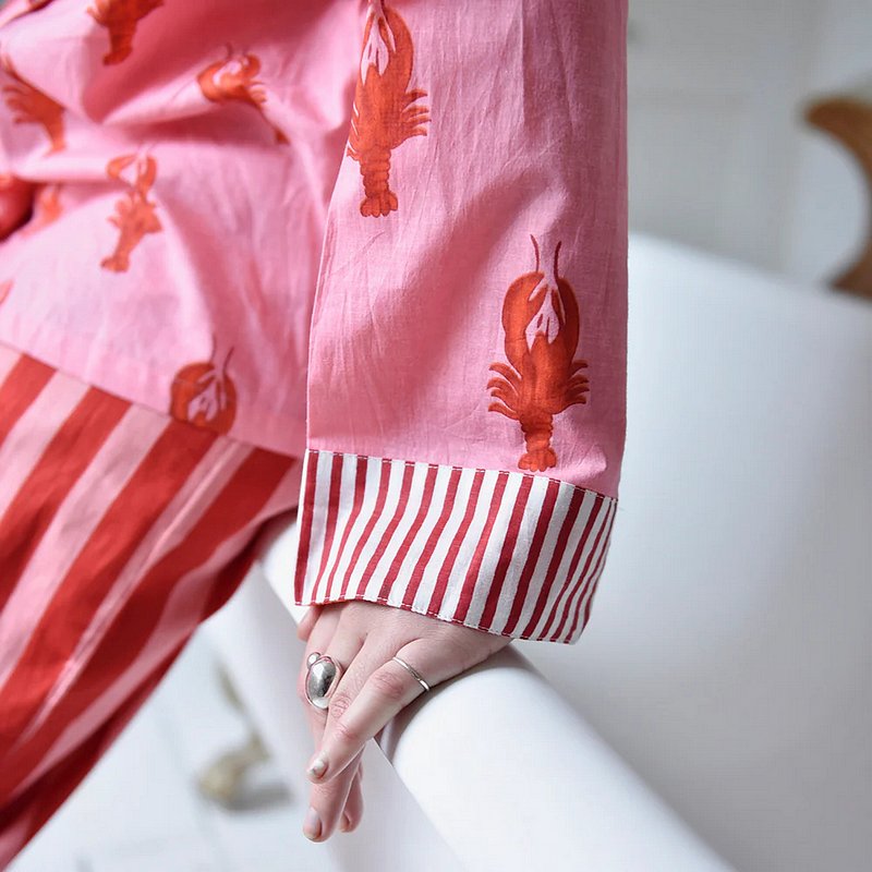 Pink & Red Lobster Print Stripy Trim Pyjamas on model lifestyle sleeve detail