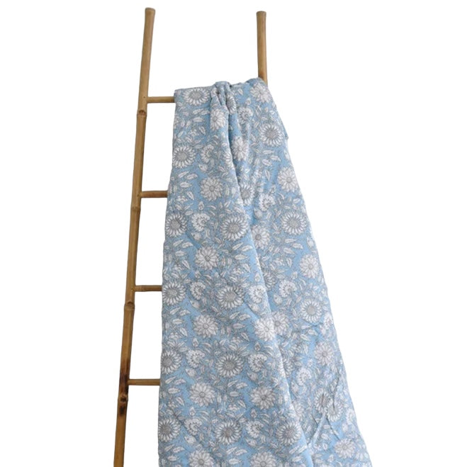 Powell Craft Cornflower Blue Floral Print Double Quilted Throw Q448 on ladder