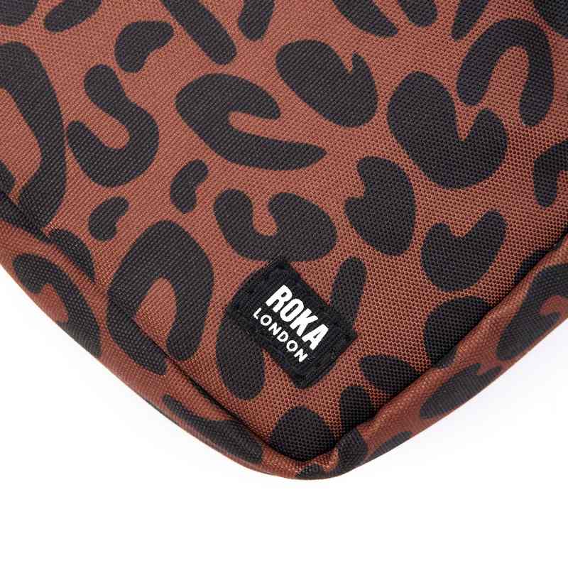 Roka Backpacks Bond Recycled Canvas Cross-body Bag Leopard Print BONDSRCSLP logo