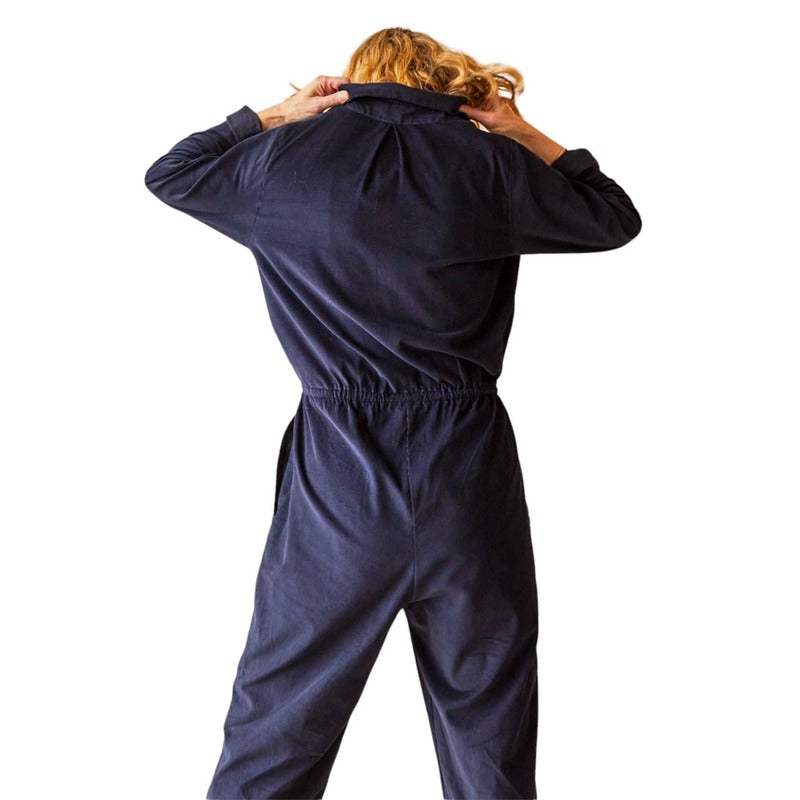 Chalk Clothing Daisy Cord Jumpsuit Navy on model pulling collar