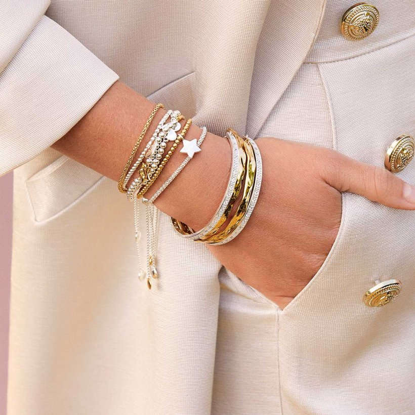 Joma Jewellery Hammered Gold Bangle on wrist