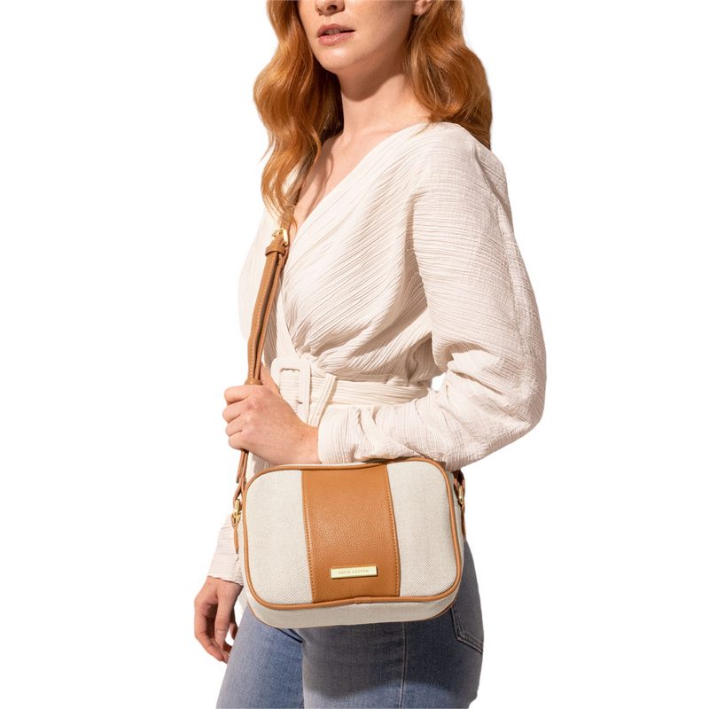 Katie Loxton Amalfi Crossbody Bag in Cream Canvas and Light Brown KLB2122 on model