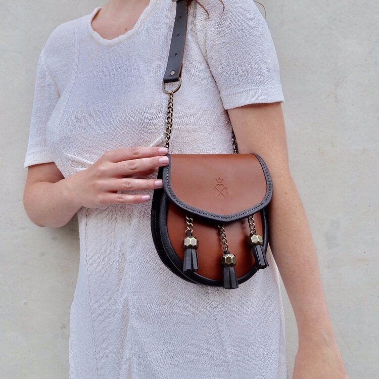 Nixey Sporran Handbag in Chestnut with Bronze Fittings on model over shoulder