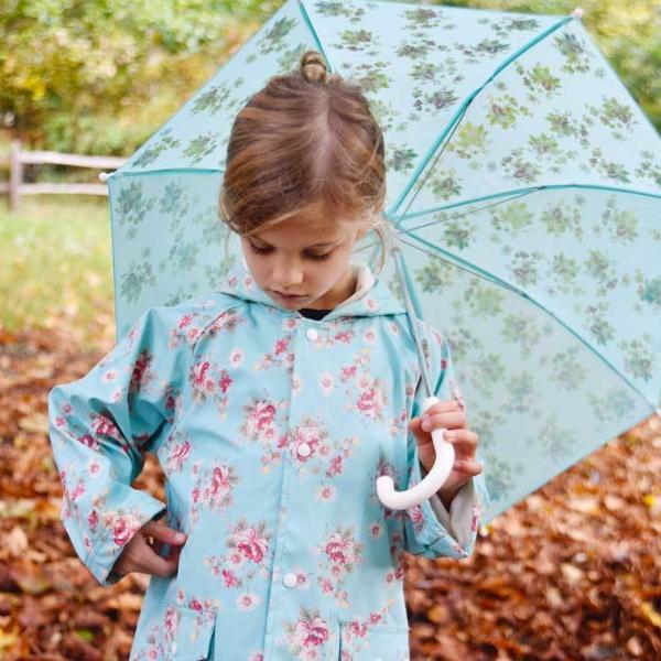 Powell Craft Blue Floral Raincoat on girl with umbrella