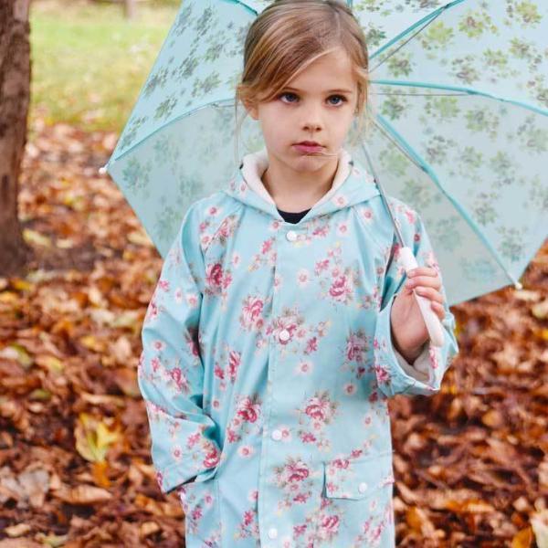 Powell Craft Blue Floral Raincoat on girl with umbrella