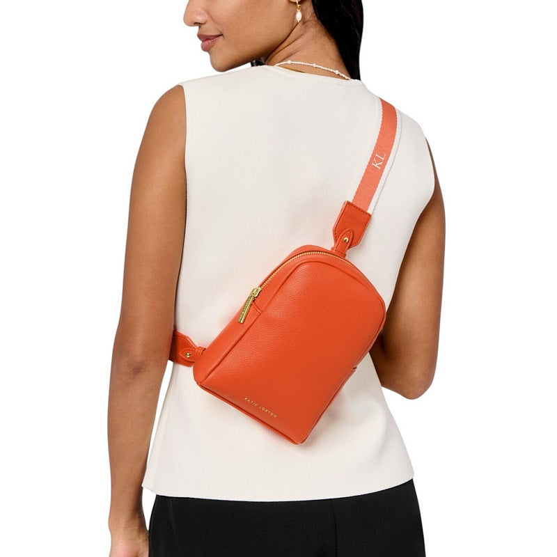 Katie Loxton Kaite Canvas Strap Sling Bag in Deep Orange KLB3994 on model