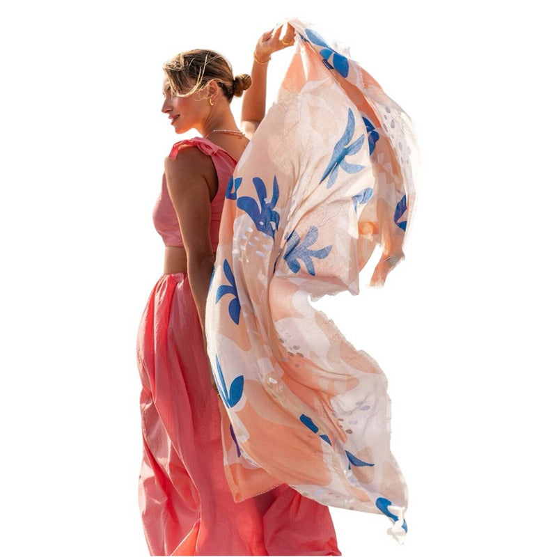 Katie Loxton Printed Foil Scarf Botanical Coral & Cobalt Blue KLS674 held by model