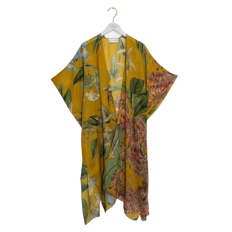 One Hundred Stars Rhodoleia Wool Throwover Gold on hanger