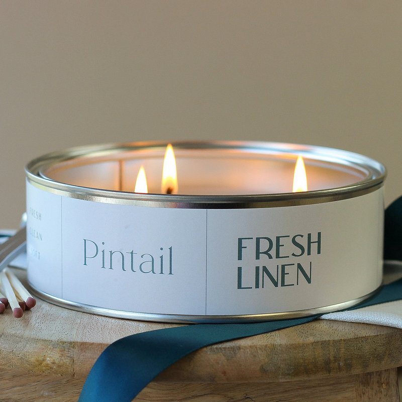 Pintail Candles Fresh Linen Triple Wick Tin lifestyle lit