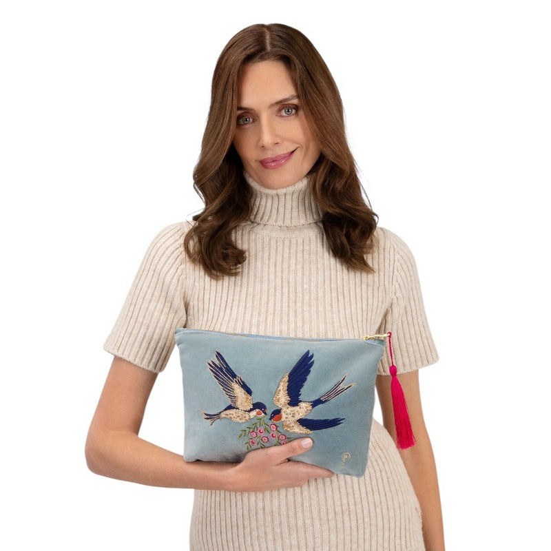 Powder Designs Velvet Zip Pouch Swooping Swallow Ice VZP28 held by model