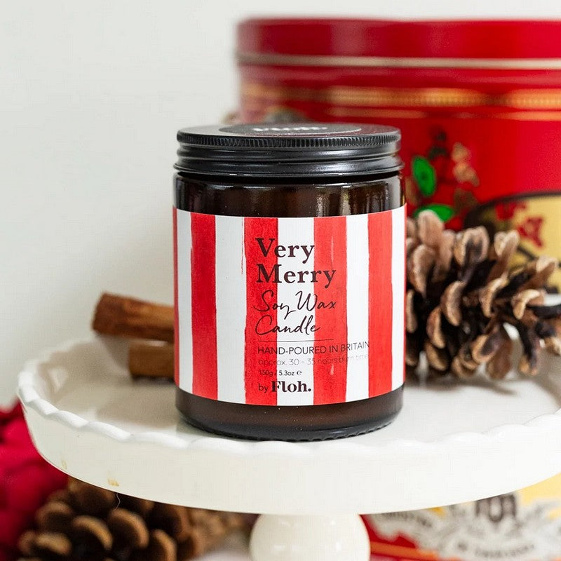 Toasted Crumpet Designs Very Merry Apothecary Candle in Glass Jar lifestyle closed
