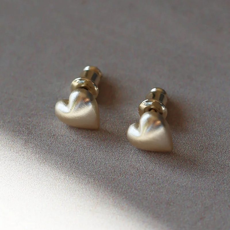 Tutti & Co Jewellery Embrace Earrings Gold EA592G on stone