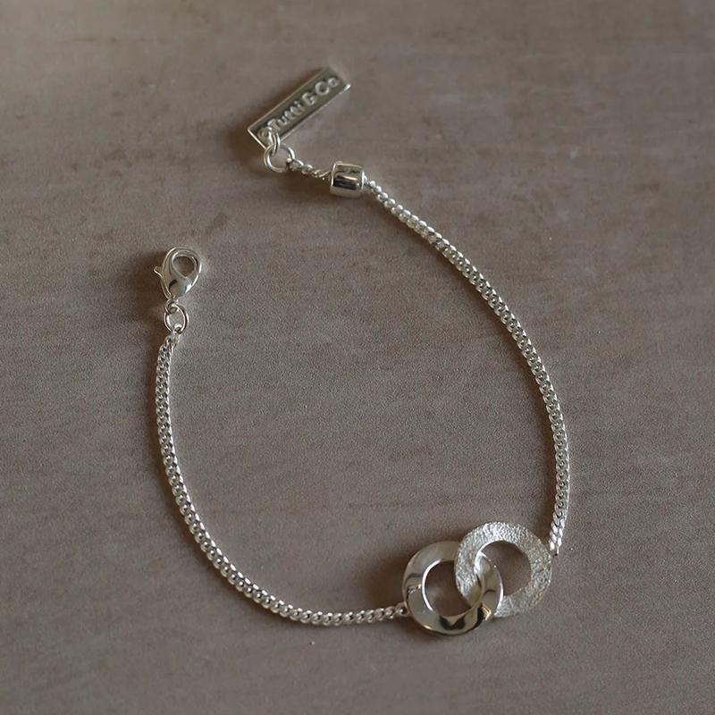 Tutti & Co Unity Bracelet Silver BR640S on stone