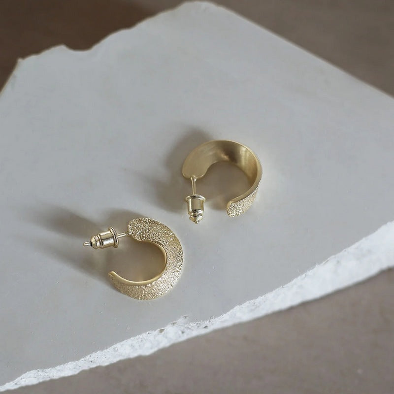 Tutti & Co Vivid Earrings Gold EA611G on stone