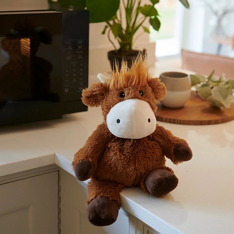 Warmies Microwaveable Plush Highland Cow CP-COW-1 with model lifestyle