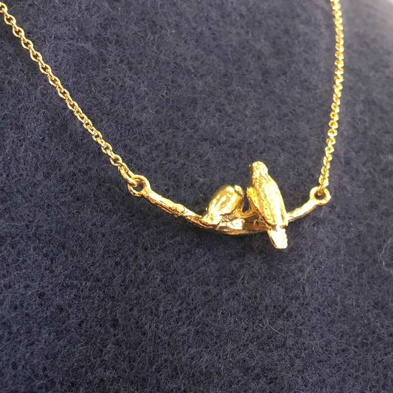 Alex Monroe Jewellery Cosy Lovebirds Necklace Gold Plate on navy scarf