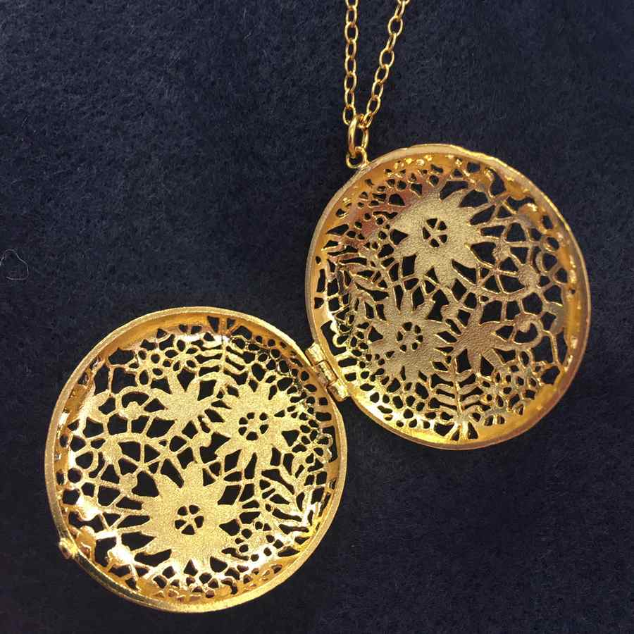 Alex Monroe Jewellery Large Chantilly Lace Locket Gold Plate open on navy scarf