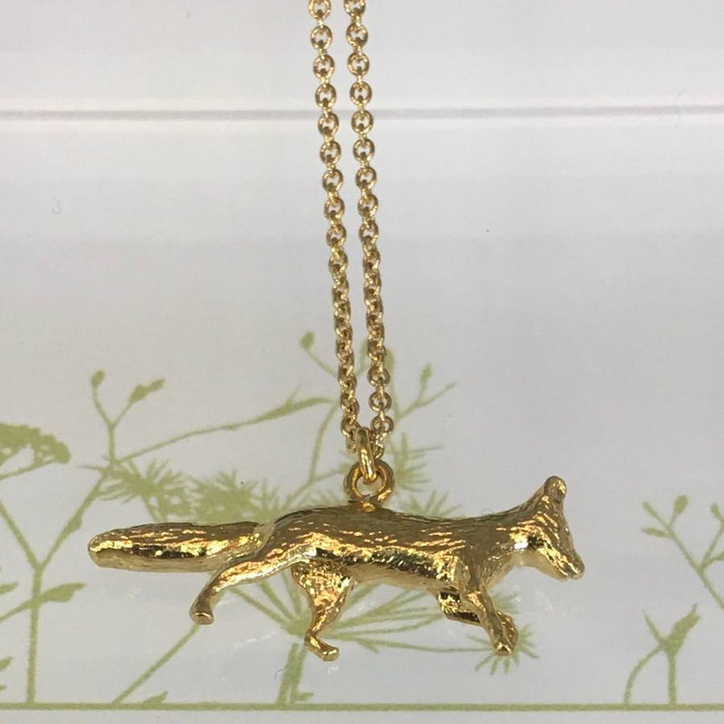 Alex Monroe Jewellery Prowling Fox Necklace Gold Plate on display stand