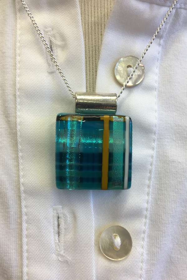 Alicia MacInnes Jewellery Skye Tartan Glass Pendant Square Necklace on blouse