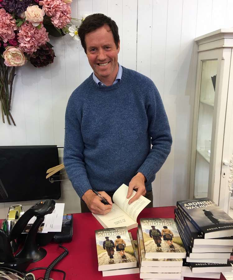 Angus MacDonald author of We Fought For Ardnish signing copies at The Old School Beauly
