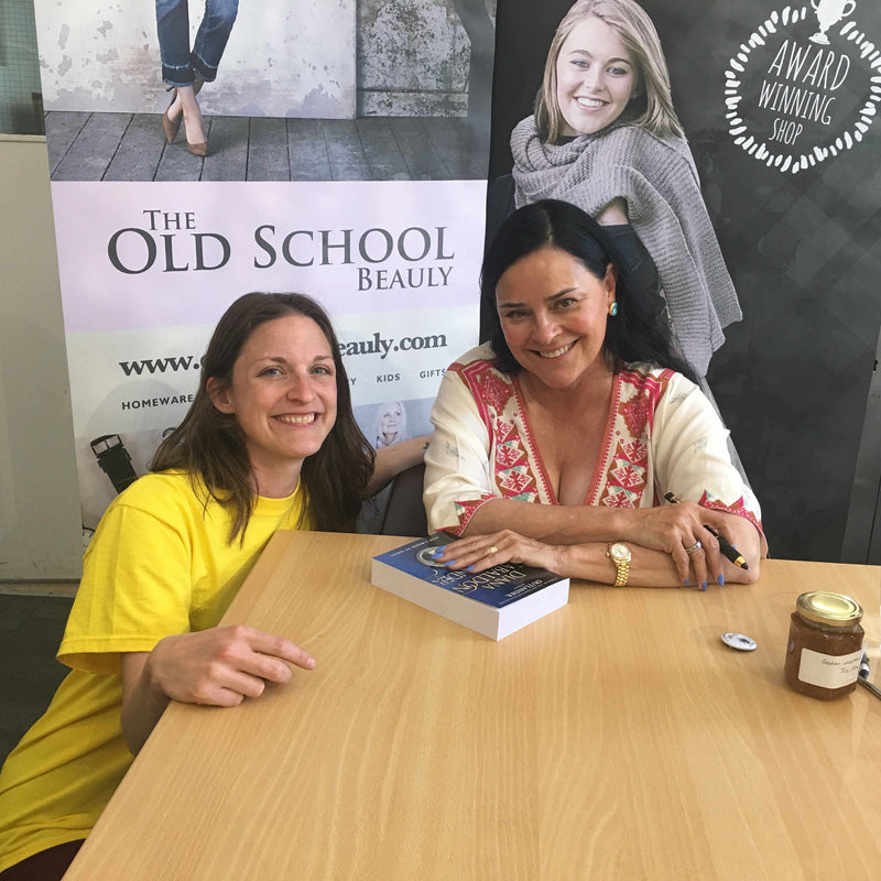 Diana Gabaldon signing a book for The Highland Hospice at The Old School Beauly