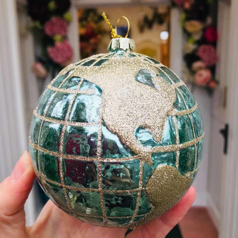 Gisela Graham Blue Gold Glass Planet Earth Ball held in hand