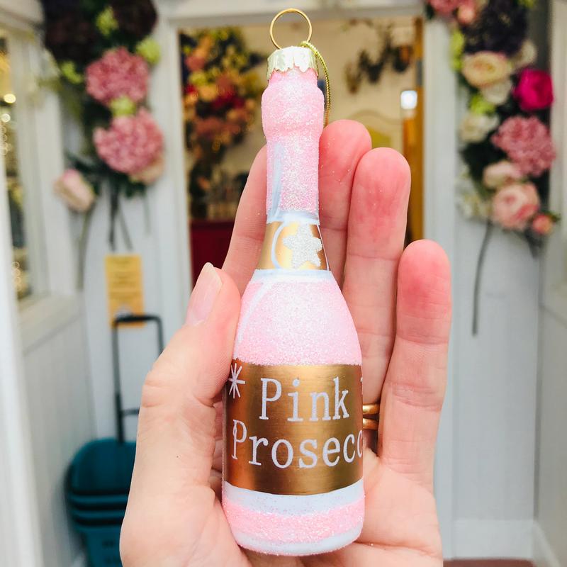 Gisela Graham Pink Prosecco Bottle Christmas Decoration held in hand