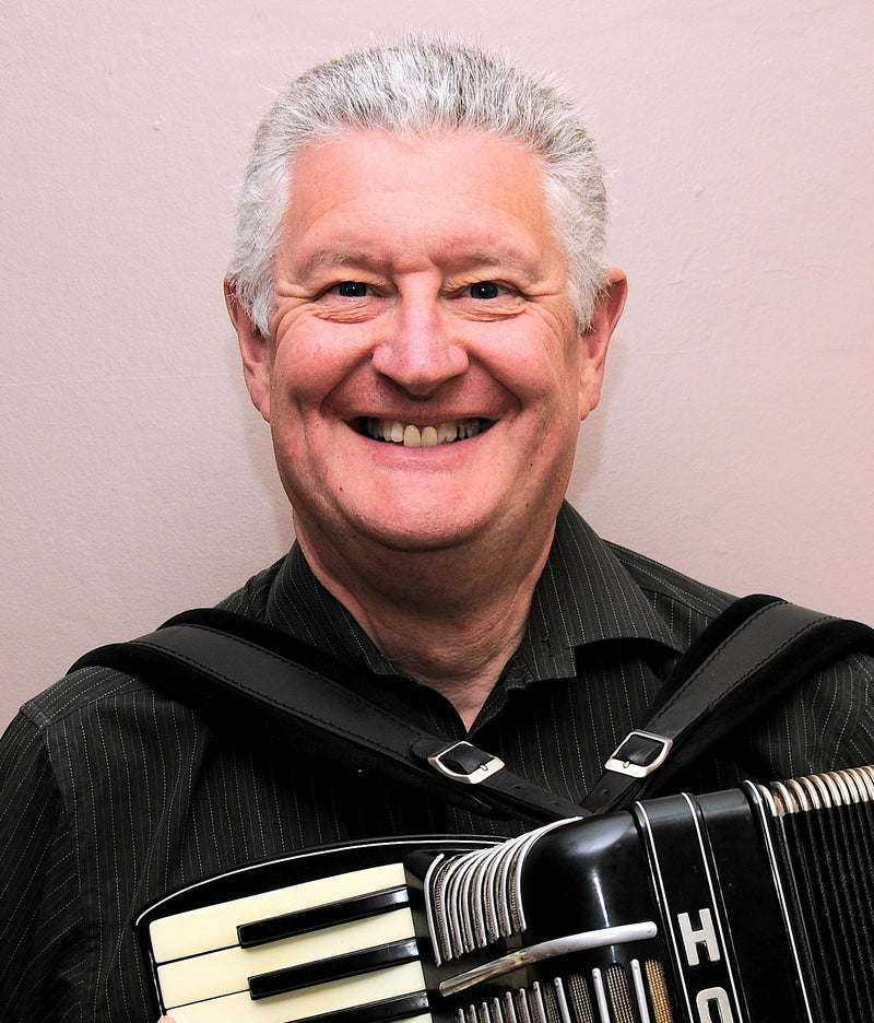 Jim Lindsay portrait with accordion
