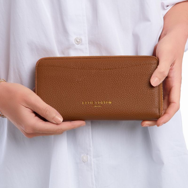 Katie Loxton Cara Purse in Cognac KLB1713 held by model