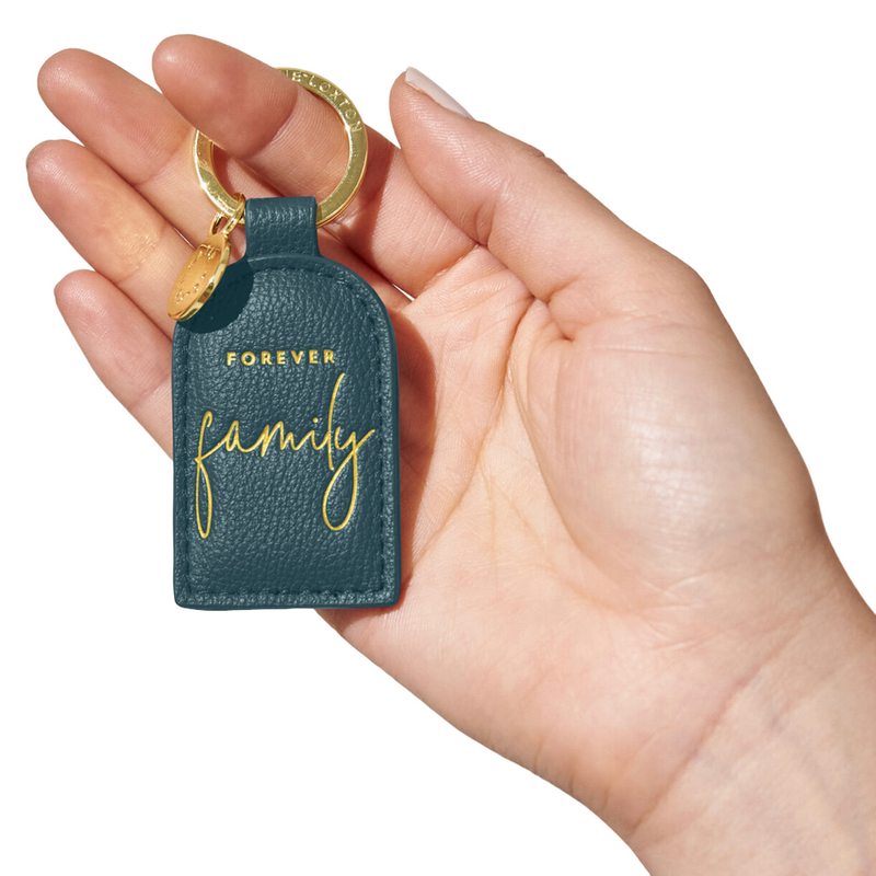 Katie Loxton Keyring Forever Family Teal KLB2358 held by model