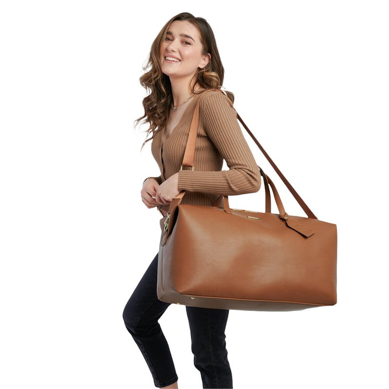 Katie Loxton Weekend Holdall Bag in Cognac Vegan Leather KLB1845 on model