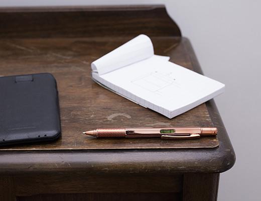 Kikkerland Copper 3 in 1 Pen Tool 4356 as spirit level on desk