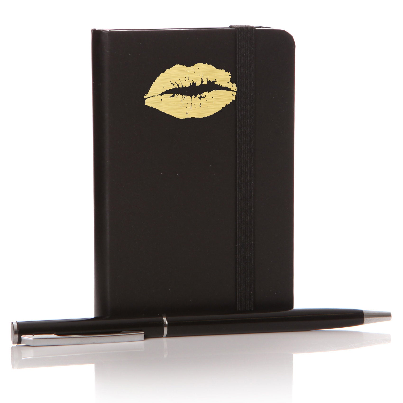 Golden Lips on a black Notebook with black Pen