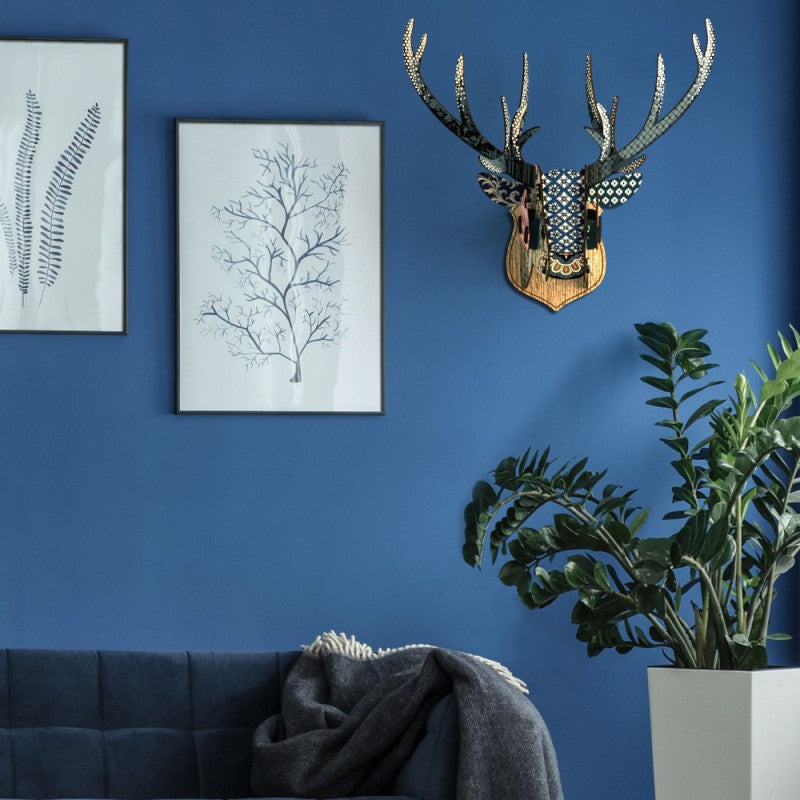 Deer Head Ornament - The Runner on blue wall